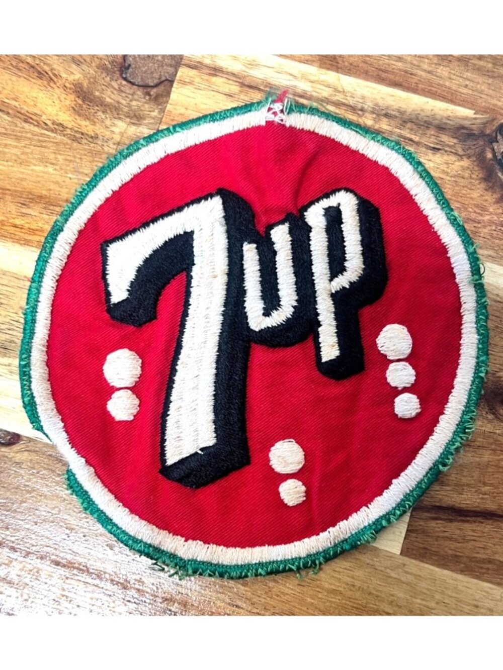 Vintage 7UP embroidered cloth patch, likely dating from the 1950s to the 1970s.